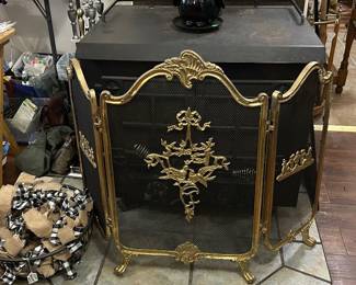 Brass edged folding fireplace screen, 