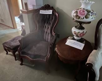 Sitting. Hair and ottoman, Hurricane lamp, side table