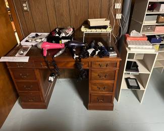 Nice wooden desk,  make-up, hair tools, kindle, tablet, pill boxes, shoe organizer 