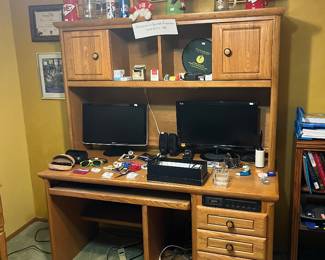 Desk, monitors, office supplies, Rayban glasses