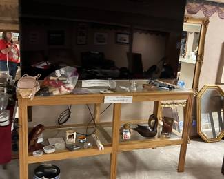 Large glass top table and 75” Samsung tv, misc decor