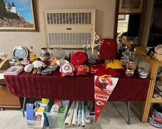 Under table, wrapping paper tissue paper,  Chiefs hats, banner, a misc stuff