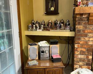 Side table, small stereo, beer steins,  Chiefs & Royals world championship steins