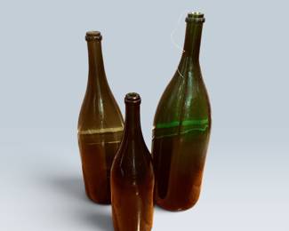 LARGE WINE BOTTLES USED AS VASES
