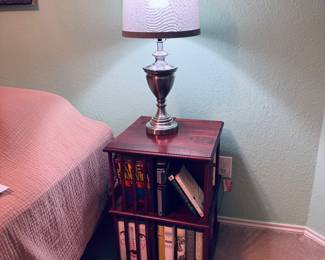 Brushed metal lamp and two tier rotating book case