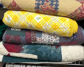 Collection of Four Vintage-Style Patchwork and Printed Quilts