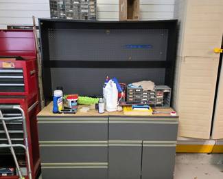 Red tool chest and gray storage cabinets in garage