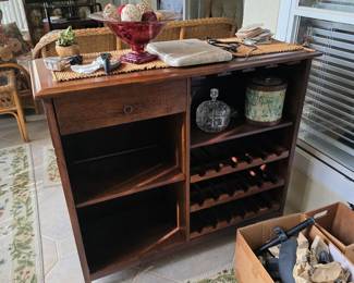 Wood bar cabinet with wine rack and storage crate