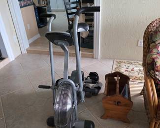 Exercise bike and wicker basket in sunroom
