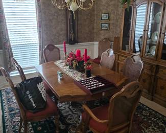 Dining room with table, chairs, china hutch and chandelier