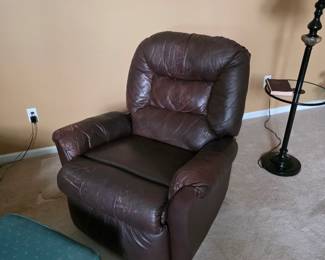 Brown leather recliner with floor lamp