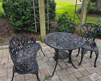 Black cast aluminum patio bistro set with table, bench and chairs