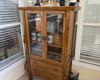 Pine display cabinet with glass doors and drawer, with collectibles