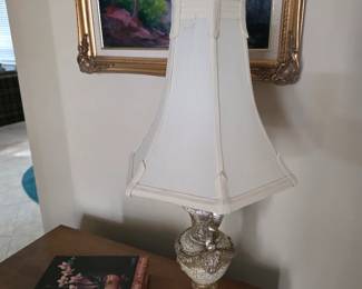 Silver-tone table lamp with white shade and lacquered box