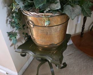 Brass planter on wrought iron plant stand with ivy