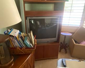 Side table, lamps, basket of paper products, vintage TV cabinet