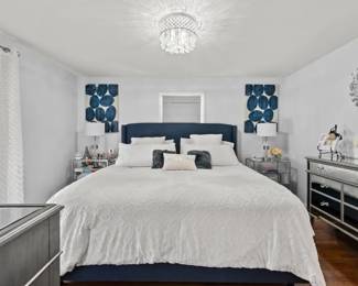 King size bed with upholstered headboard, Married dresser and a small dresser to match two end tables,