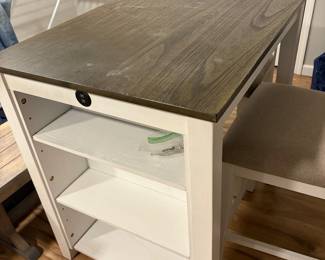 Apartment size table with two chairs and storage