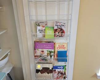 Collection of Assorted Cookbooks with OvertheDoor Storage Rack