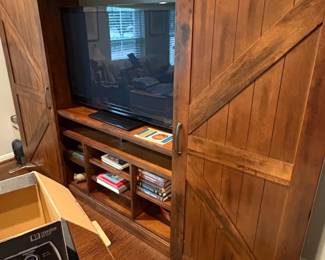Rustic Farmhouse Barn Door Entertainment Center with Integrated Shelving