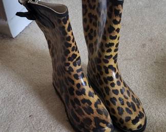 Pair of pull-on rain boots with a leopard print pattern in brown and tan. The boots appear to be made of rubber or synthetic material suitable for wet weather.