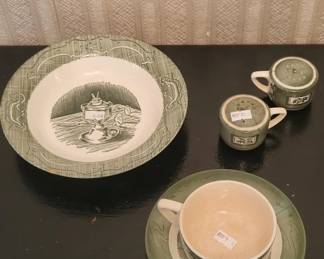 Set of vintage ceramic dishes featuring a scenic landscape design with a woven or textured border pattern. Includes a large serving bowl, cups, and saucers in cream and gray tones.