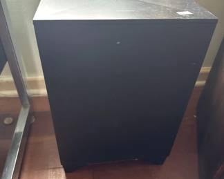 Black rectangular cabinet or media stand with a light-colored top surface. The piece appears to be in good condition with a clean, minimalist design suitable for storage or electronics display.
