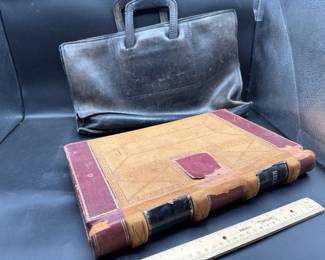 Antique leather bag & accounting ledger.