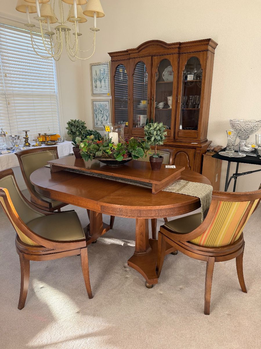 DAVIS FURNITURE CO. dining table, 3 leaves, table pad along with 4 GRAND LEDGE CHAIR CO. chairs.  DAVIS FURNITURE CO. China cabinet.