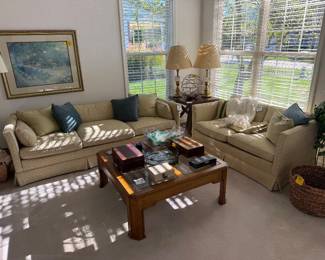 Vintage skirted couch and loveseat, glasstop coffee table, brass lamps, farmhouse endtable,