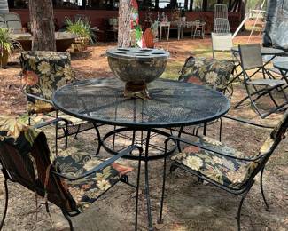 Wrought iron table with four chairs.