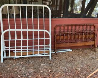 Solid cast-iron bed with rails, wood spool bed. Both are full-size.