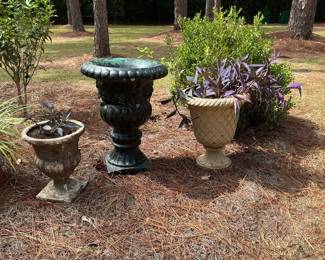 Concrete black garden urn… the two other planters are fiber cast.
