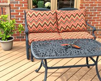 Rocker cast aluminum loveseat with Sunbrella cushions , matching chairs, coffee table, end table