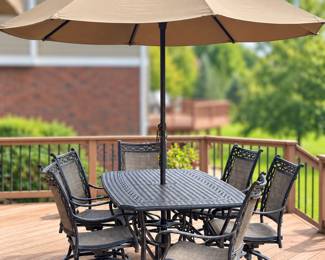 Patio table with 6 swivel chairs and umbrella