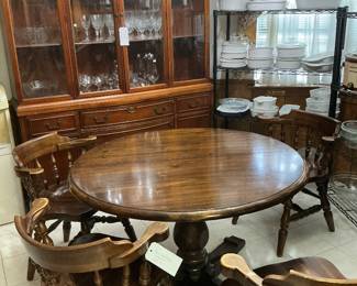 This kitchen table comes with four chairs and two extra leaves, that’s a Drexel China cabinet in the background