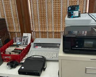 Several different sizes of filing cabinets, three Wi-Fi Bluetooth printers, brother typewriter