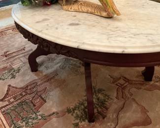 Pheasants sitting on a Kimball table
