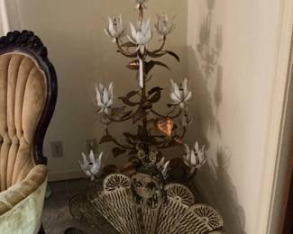 This is a mid-century lotus lamp from the 60s, heavy brass peacock fireplace screen