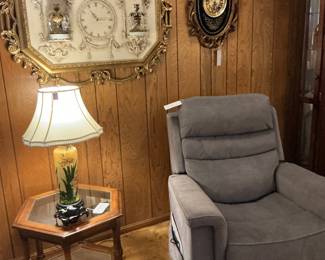 The recliner is a lift chair with a massage the clock behind it isn’t Art Nouveau clock