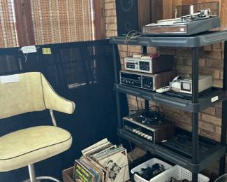 We uncovered eight tracks turn tables, DVD CD players they all seem to work definitely a 60s barstool
