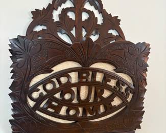Carved wood hanging magazine rack 