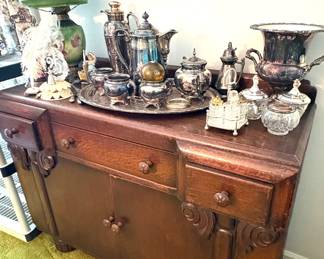 Stunning antique oak sideboard with antique and vintage silver plate