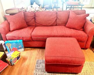 Red sofa w/ottoman in good condition.