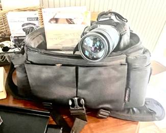 Canon 35mm camera with accessories.
