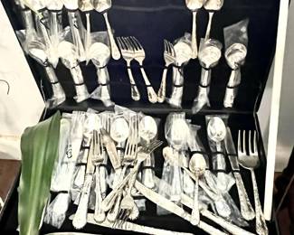Silver-plated flatware in abundance.