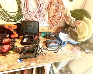 Assorted electric tools including Ryobi, Black & Decker and Skil.