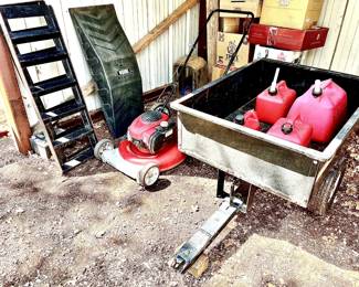 Handy dandy two wheel trailer, push mower, metal ramps and a skate board ramp.