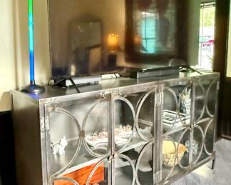 #27 - $585 -Industrial display cabinet 74Wx16Dx40H & #28 - $325 Westinghouse TV 70" Roku TV August 2023 with soundroofer