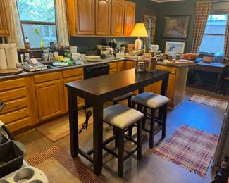 5' x 20" x 36"tall bar table with 3 barstools. Table has power strip built in . Nice! Heavy!